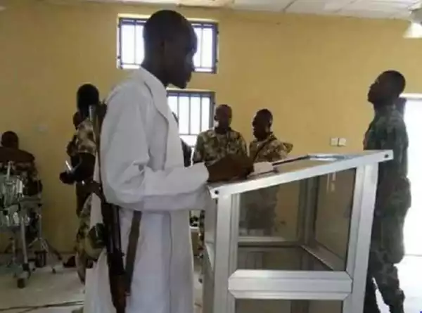 End Time!! Catholic Priest Seen With Loaded Rifle In Church (See Photo)